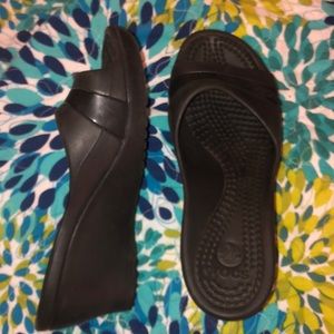 Black slip on Crocs. Worn but still have life.